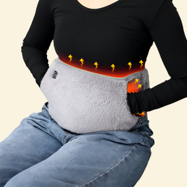 Person wearing the Warmweave USB heated waist belt with snug hand pockets, providing soothing back and stomach warmth